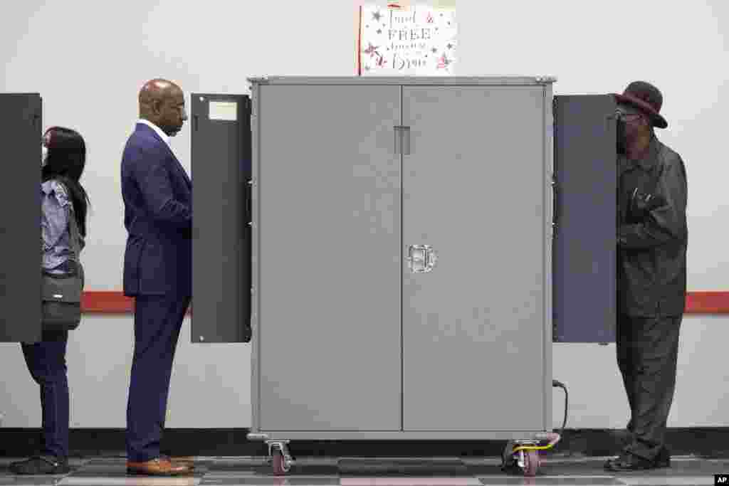 U.S. Sen. Raphael Warnock, D-Ga., votes on the first day of early voting in Atlanta, Georgia.