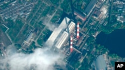 FILE - This satellite image provided by Maxar Technologies shows damage to a power station in Kyiv, Ukraine, Oct. 12, 2022, following a Russian strike.