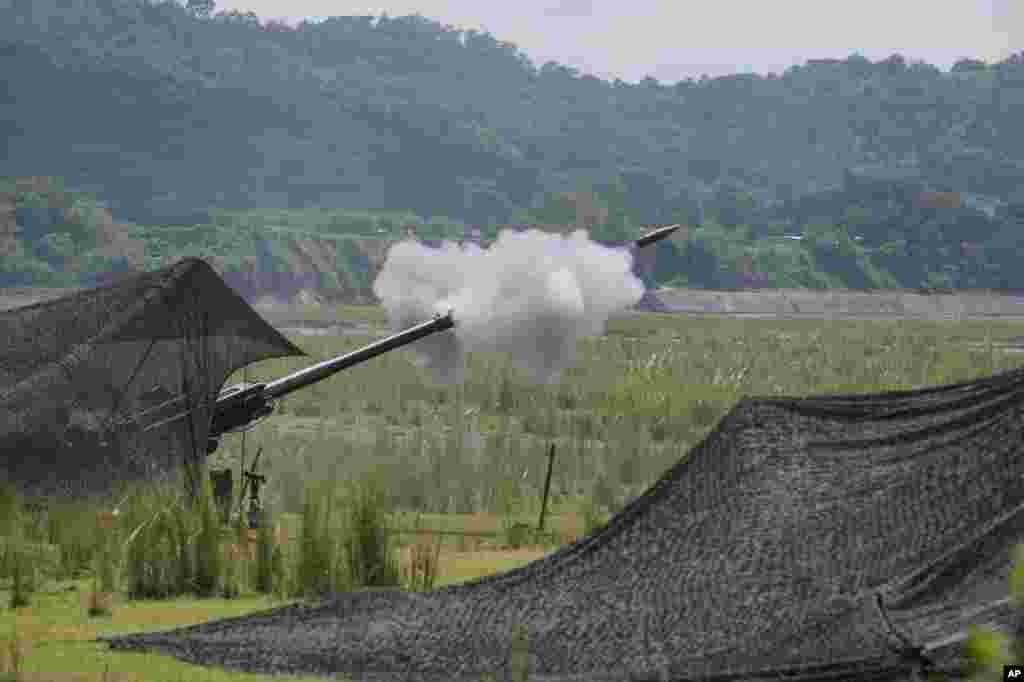 A U.S .155mm Howitzer fires a round during yearly combat drills between the Philippine Marine Corps and U.S. Marine Corps in Capas, Tarlac province, northern Philippines, Oct. 13, 2022.