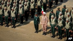 FILE - In this photo from the Islamic Revolutionary Guard Corps' Ground Force on Oct. 17, 2022, troops stand while attending a maneuver in northwestern Iran. 