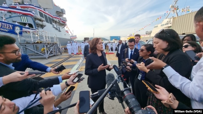 U. S. Vice President Kamala Harris speaks with reporters after visiting the USS Howard naval destroyer at Yokosuka Naval Base outside Tokyo, Sept. 28, 2022.