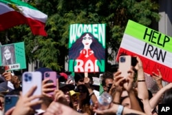 FILE - Iranian Americans participate in a rally in downtown Los Angeles, Oct. 1, 2022, in solidarity with women in Iran.