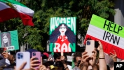 Iranian Americans participate in a rally in downtown Los Angeles, Oct. 1, 2022, in solidarity with women in Iran.