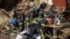 Rescuers extract a body from a residential building destroyed by a Russian drone strike, which local authorities attributed to an Iranian-made Shahed-136 unmanned aerial vehicle, in Kyiv, Ukraine, Oct. 17, 2022. (REUTERS/Vadim Sarakhan)