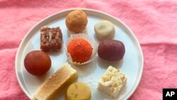 An assortment of sweets from an Indian food shop are displayed in New York on Oct. 19, 2022. These sweets are typically enjoyed on Diwali, the Hindu festival of lights. 