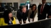 U.S. Secretary of State Antony Blinken, second left, watches screens as he visits the National Electricity Coordinator control room in Santiago, Chile, Oct. 5, 2022.