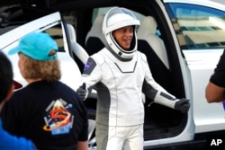 SpaceX Crew5 NASA astronaut Nicole Mann leaves the Operations and Checkout building before heading to Launch Pad 39-A at the Kennedy Space Center in Cape Canaveral, Fla., Oct. 5, 2022.