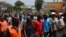 Protesters march against the rising cost of living and what they claim is poor governance, in Blantyre, Malawi, Oct. 27, 2022. (Lameck Masina/VOA)
