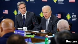 U.S. President Joe Biden sits next to Secretary of State Antony Blinken as he delivers remarks at the U.S.- Pacific Island Country Summit at the State Department in Washington, U.S. September 29, 2022. 