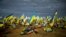 Ukrainian flags are seen in a cemetery next to graves of recently killed Ukrainian servicemen, as Ukraine marks Defenders Day, in Kharkiv, Oct. 14, 2022.