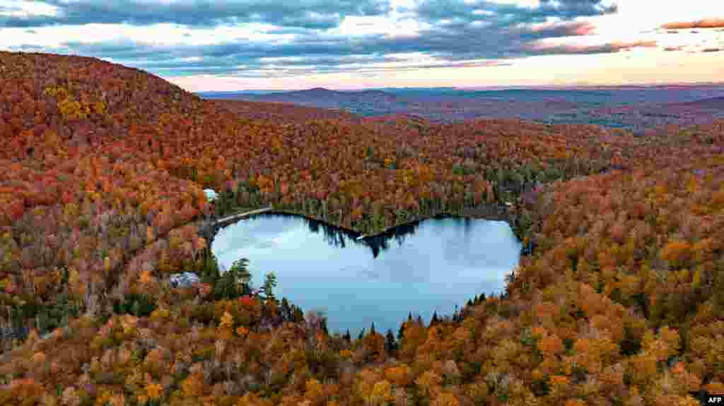 In this image from above, Baker Lake near East Bolton, Quebec, Canada,&nbsp;is surrounded by fall colors.