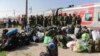 Russian recruits gather to take a train at a railway station in Prudboi, Volgograd region of Russia, Sept. 29, 2022.