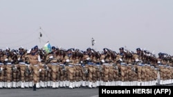 FILE - National army troops parade during ceremonies marking the 41st anniversary of Djibouti's independence in Djibouti on June 27, 2018. 