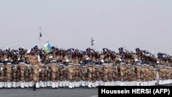 FILE - National army troops parade during ceremonies marking the 41st anniversary of Djibouti's independence in Djibouti on June 27, 2018. 