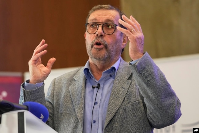 French physicist Alain Aspect speaks during a press conference, Tuesday, Oct. 4, 2022 in Palaiseau, outside Paris. (AP Photo/Michel Euler)