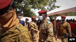 FILE - Burkina Faso's new leader Captain Ibrahim Traore arrives for a ceremony to honor soldiers killed in an earlier ambush in Gaskinde, in Ouagadougou on Oct. 8, 2022.