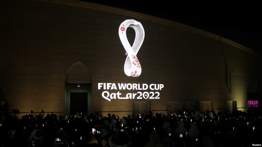 FILE - The tournament's official logo for the 2022 Qatar World Cup is seen on the wall of an amphitheater, in Doha, Qatar, Sept. 3, 2019.