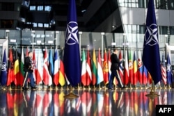 FILE - The national flags of North Atlantic Treaty Organization members are seen at NATO headquarters in Brussels, October 12, 2022.