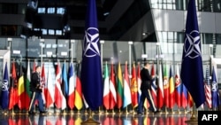 The national flags of the members North Atlantic Treaty Organization(NATO) are seen ahead of a two-day meeting of the alliance's Defence Ministers at the NATO Headquarter in Brussels, Oct. 12, 2022. 