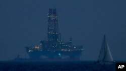 FILE - An offshore drilling rig is seen in the waters off Cyprus' coastal city of Limassol, July 5, 2020.
