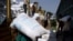 FILE - Laborers offload bags of grains as part of relief food that was sent from Ukraine at the World Food Program (WFP) warehouse in Adama town, Ethiopia, on Sept. 8, 2022.