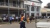Zimbabwe People queue at the bank
