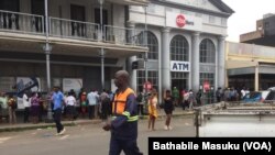 Zimbabwe People queue at the bank