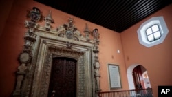 FILE - The Palafoxiana Library with its high, vaulted ceiling and gold-framed painting of the Virgin Mary - looks like a chapel, in Puebla, Mexico, Sept. 13, 2022.