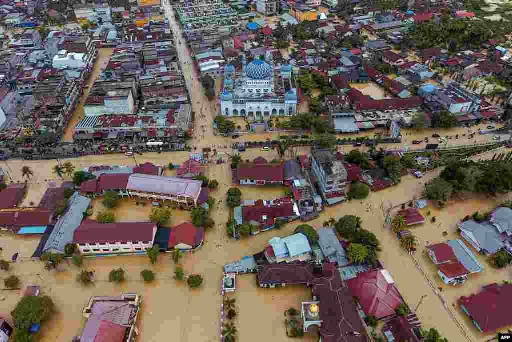 This aerial picture shows a flooded area in Lhoksukon, North Aceh, Indonesia, due to heavy rain over the past week and breached river embankments.