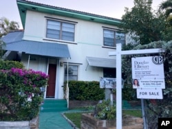 FILE -- A house for sale in Surfside, Florida. Investors making cash offers are pushing affordable home ownership out of reach for many Americans.