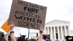 FILE - People protest at the Supreme Court following the high court's decision to overturn Roe v. Wade in Washington, June 24, 2022.