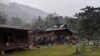 Debris from air strikes scatters about destroyed wooden structures near Aung Bar Lay Village, Hpakant township, Kachin state in Myanmar on October 24, 2022. (Associated Press)