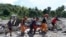 Rescuers carry a body at Maguindanao's Datu Odin Sinsuat town, southern Philippines, Oct. 30, 2022. 