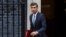 Britain's Prime Minister Rishi Sunak walks outside Number 10 Downing Street, in London, Britain, Oct. 26, 2022.