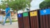 A man walks past recycle bins in Egypt's Red Sea resort of Sharm el-Sheikh town as the city prepares to host the COP27 summit next month, in Sharm el-Sheikh, Egypt Oct. 20, 2022.