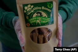 A package of Pawsitive Bones, a dog treat, produced by Food Shift, made of ingredients that are usually discarded, is shown Tuesday, Sept. 13, 2022 in Alameda, California. (AP Photo/Terry Chea)