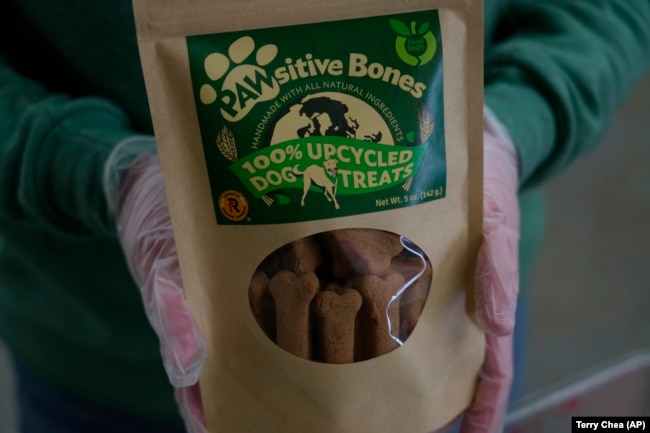 A package of Pawsitive Bones, a dog treat, produced by Food Shift, made of ingredients that are usually discarded, is shown Tuesday, Sept. 13, 2022 in Alameda, California. (AP Photo/Terry Chea)