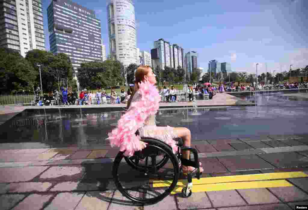 A model presents a creation by a Mexican designer during a catwalk show promoting diversity and inclusion to foster acceptance and removal of barriers that disabled people face in the country, in Mexico City, Mexico, Oct. 26, 2022. 