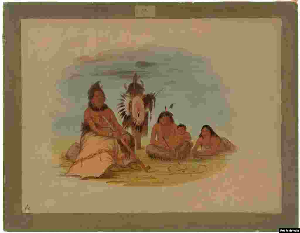 Heavily tattooed Hidatsa Chief Eh-toh'k-pah-she-pée-shah, in old age, surrounded with family. Painting by George Catlin, 1832.