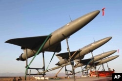 FILE - In this photo released by the Iranian army on Aug. 24, 2022, drones are prepared for launch during a drone drill in Iran.