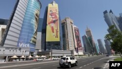 A banner bearing the picture of Wales' Gareth Bale hangs in the Qatari capital of Doha ahead of the FIFA 2022 football World Cup, Oct. 11, 2022.