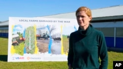 USAID Administrator Samantha Power during her visit to farmers who receive drone spraying service from USAID in outskirts of Kyiv, Ukraine, Oct. 6, 2022. 