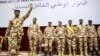 FILE - General Mahamat Idriss Deby, left, gestures during the opening ceremony of a national dialogue meeting in N'Djamena, Chad, on Aug. 20, 2022. The self-declared interim president will run in the May 6 presidential election announced on Feb. 27, 2024.