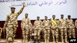 FILE - General Mahamat Idriss Deby, left, gestures during the opening ceremony of a national dialogue meeting in N'Djamena, Chad, on Aug. 20, 2022. The self-declared interim president will run in the May 6 presidential election announced on Feb. 27, 2024.