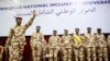 FILE - Chad transition leader Mahamat Idriss Deby (L) gestures during the opening ceremony of a national dialogue meeting at the January 15 Palace in N'Djamena, Aug. 20, 2022.