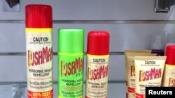 FILE - Cans of insect repellent sit on a shelf at a shop in central Sydney, Australia Feb. 3, 2016.