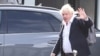 Former British Prime Minister Boris Johnson walks, at Gatwick Airport, near London, Britain, Oct. 22, 2022. 