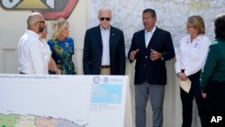 President Joe Biden and first lady Jill Biden receive a briefing on Hurricane Fiona damage from Puerto Rico Gov. Pedro Pierluisi, Oct. 3, 2022, in Ponce, Puerto Rico.