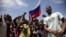 FILE - Young men chant slogans against France and pro-Russia in Ouagadougou, Burkina Faso, Sept. 30, 2022.