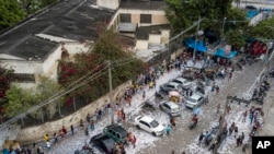 Voters line up at a polling post in the Mare neighborhood in Rio de Janeiro, Brazil, Oct. 2, 2022.